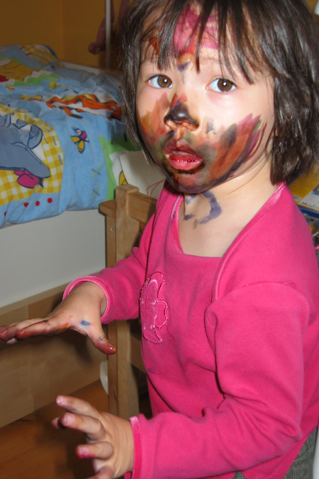 Cookies & Clogs | Everything changes when you have kids. Parenthood makes you do and say things you never thought you'd do when raising children. See how our parenting experience has gone and what two things have helped with cleaning up their messes. Female child with marker on face and hands.